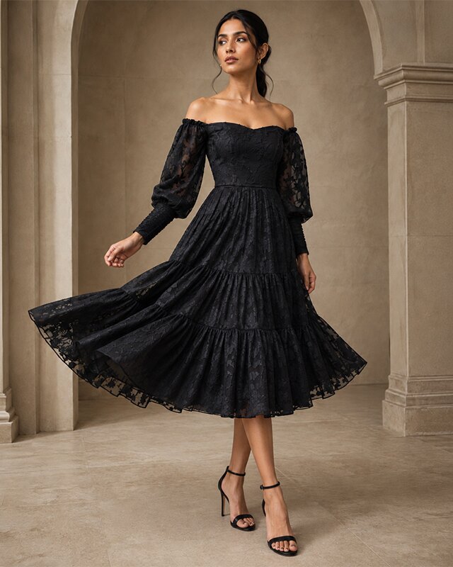 Model wearing an off-shoulder tiered lace gown