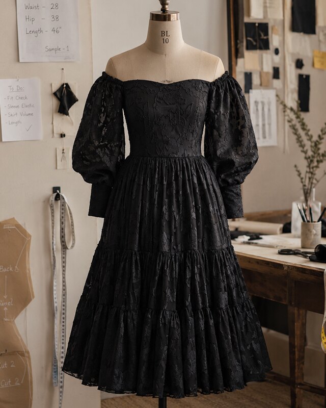 Dress form with off-shoulder lace gown in the Adorn Aura atelier